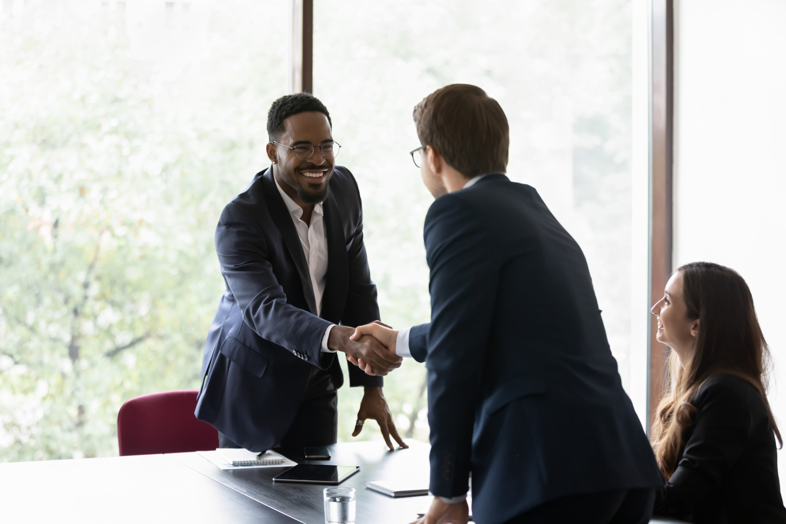 business partners start group meeting shake hands express regard. Happy candidate get hired job interview accomplish. Gesture of approval acceptance, business promises concept